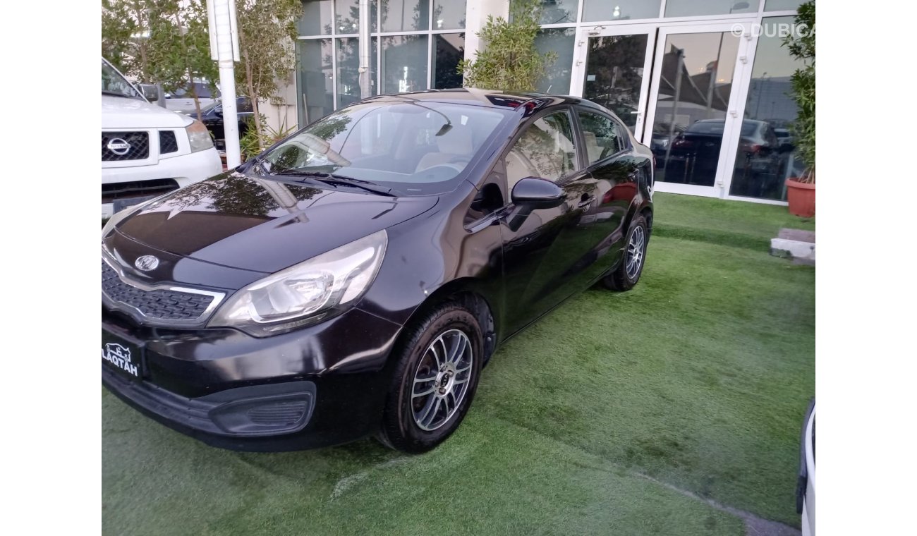 Kia Rio Gulf model 2013, black color, without accidents, wheels in excellent condition, you do not need any