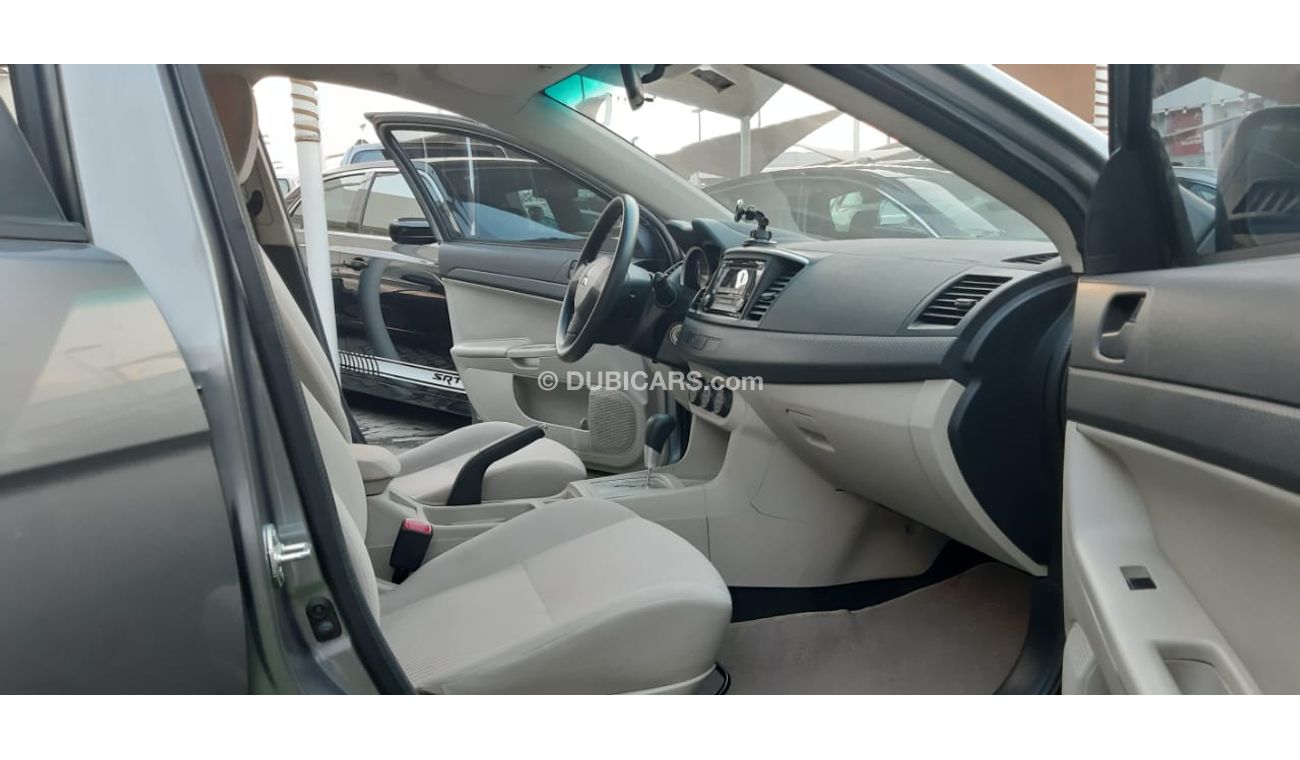 Mitsubishi Lancer Mitsubishi Lancer Gulf 2015 model gray color inside beige without accidents alloy wheels rear wing s