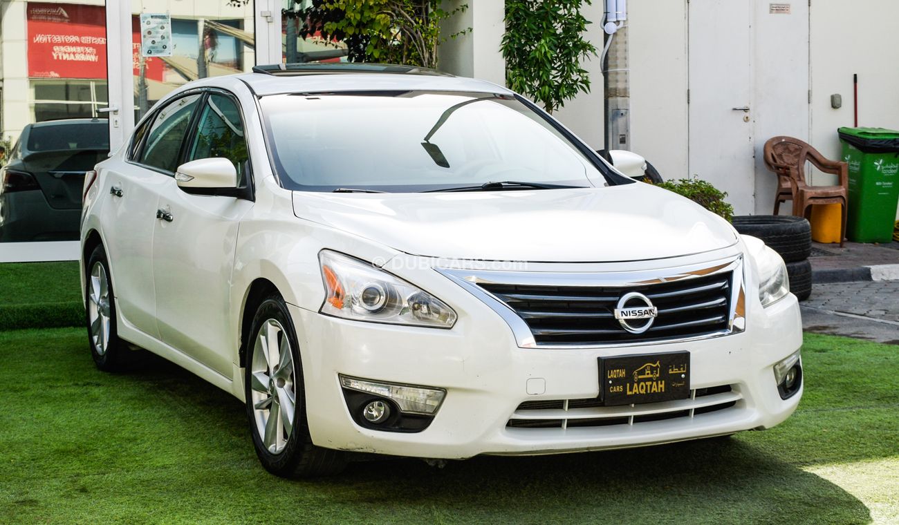 Nissan Altima White color inside Big Ward No.1 fingerprint slot, leather alloy wheels, camera screen control senso