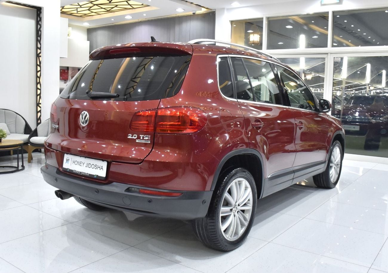 Volkswagen Tiguan SEL EXCELLENT DEAL for our Volkswagen Tiguan 2.0 TSi 4Motion ( 2014 Model ) in Red Color GCC Specs