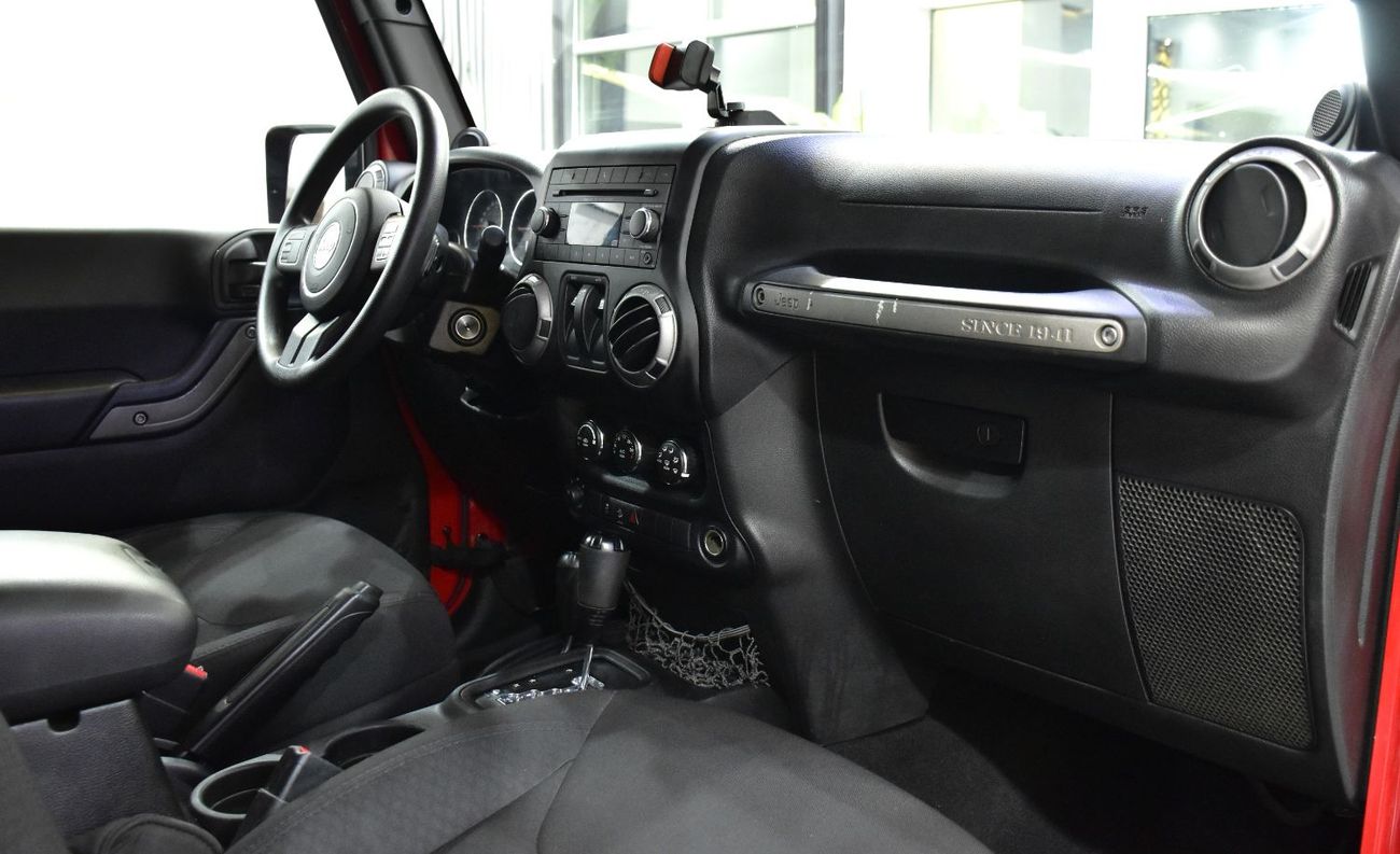 Jeep Wrangler EXCELLENT DEAL for our Jeep Wrangler Sport ( 2014 Model ) in Red Color GCC Specs