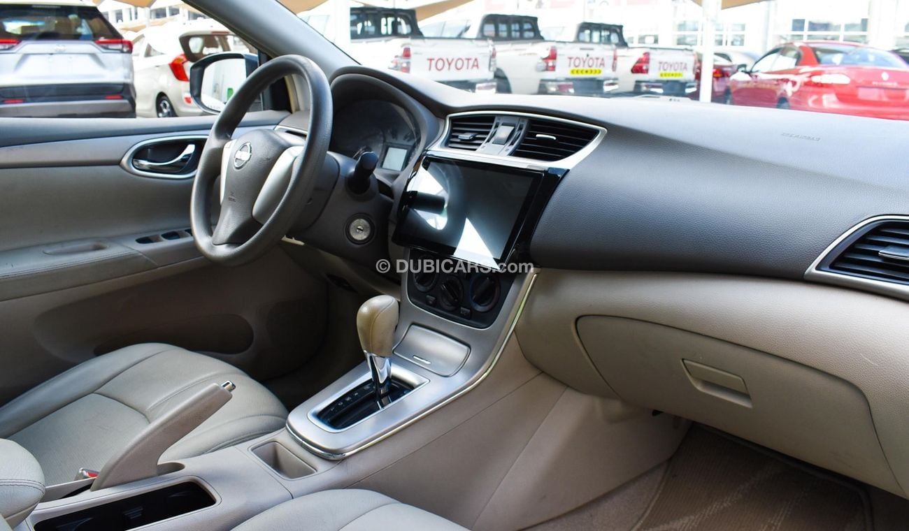 Nissan Sentra GCC, 2016 model, without accidents, white color, beige leather interior, Android screen, rear camera