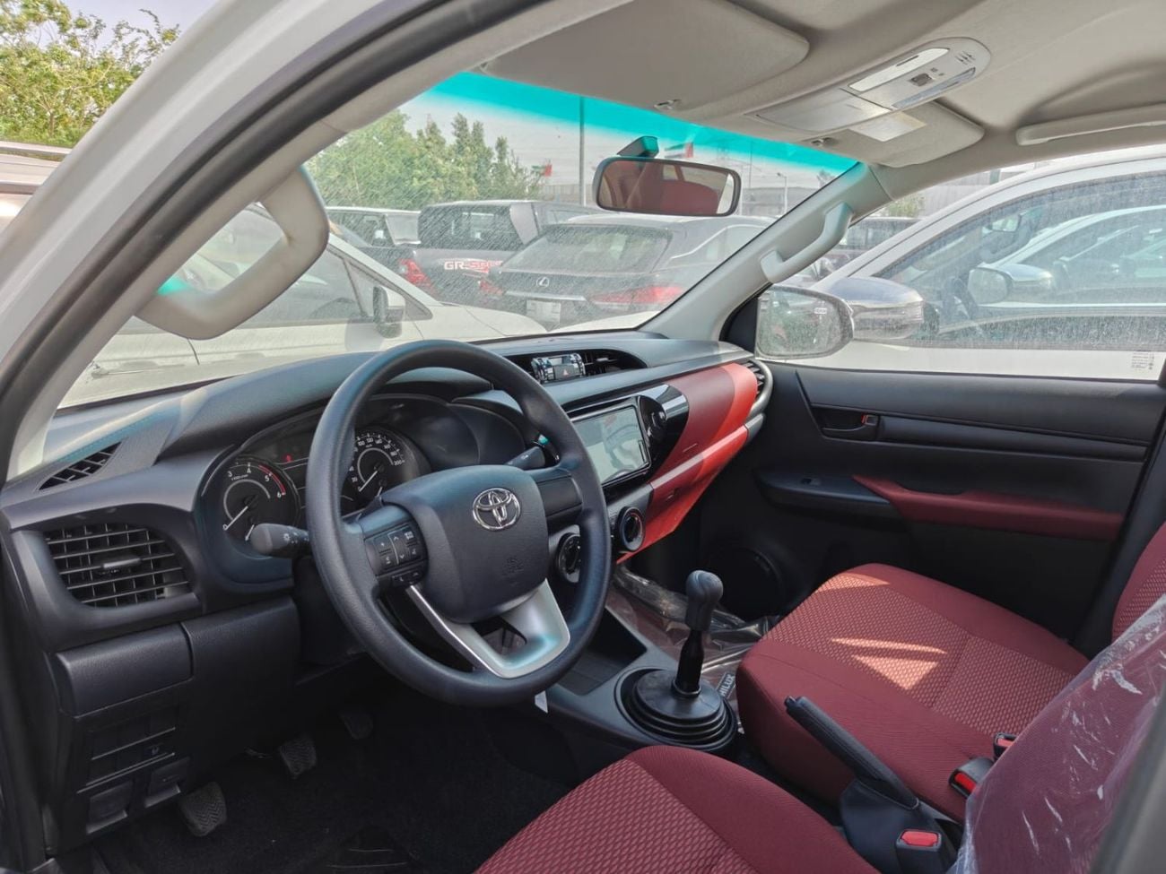 تويوتا هيلوكس 2026 Toyota Hilux white/red 2.4L diesel manual GCC spec mid option