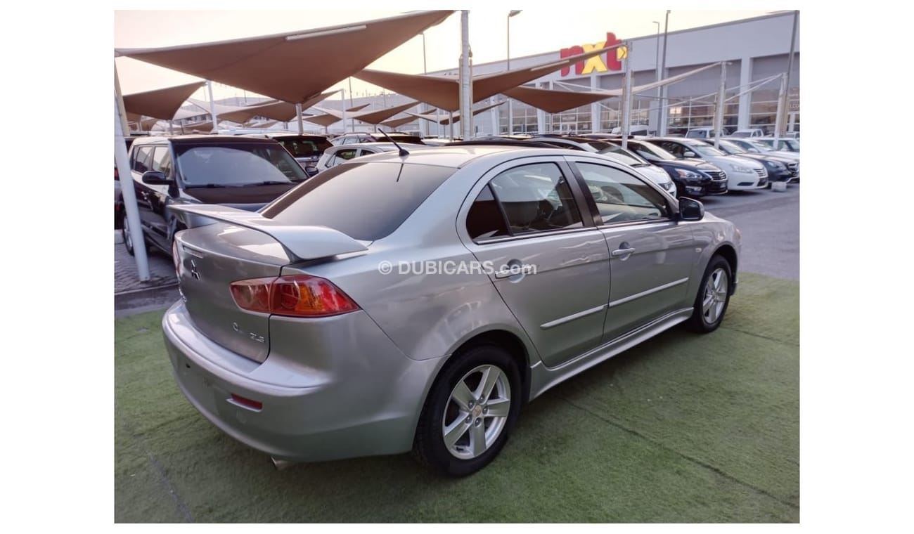 ميتسوبيشي لانسر 1600سى سى موديل 2009 خليجى فل أوبشن  خشب فتحة شاشة كاميرا خلفية بحالة ممتازة