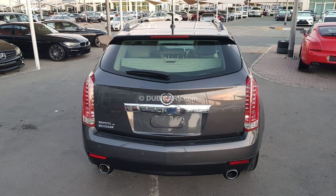 كاديلاك SRX موديل 2011 خليجي فل مواصفات كراسي جلد ومثبت سرعه وتحكم كهربي كامل ونظام صوت ممتاز وكاميرا خلفيه ومدخ