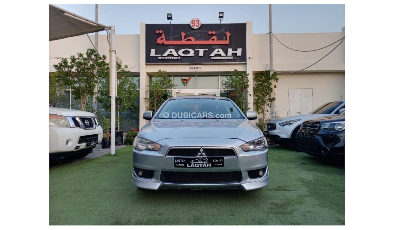 ميتسوبيشي لانسر 1600سى سى موديل 2009 خليجى فل أوبشن  خشب فتحة شاشة كاميرا خلفية بحالة ممتازة