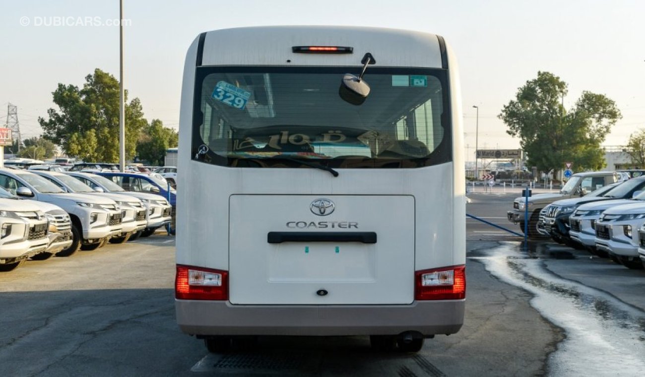 Toyota Coaster 4.2L V6 M/T Diesel 23 passengers - 16″ wheels - brown interior