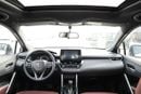 تويوتا كورولا كروس 2025 TOYOTA COROLLA CROSS MID 1.8 Hybrid - PLATINUM WHITE PEARL inside RED | Export Only