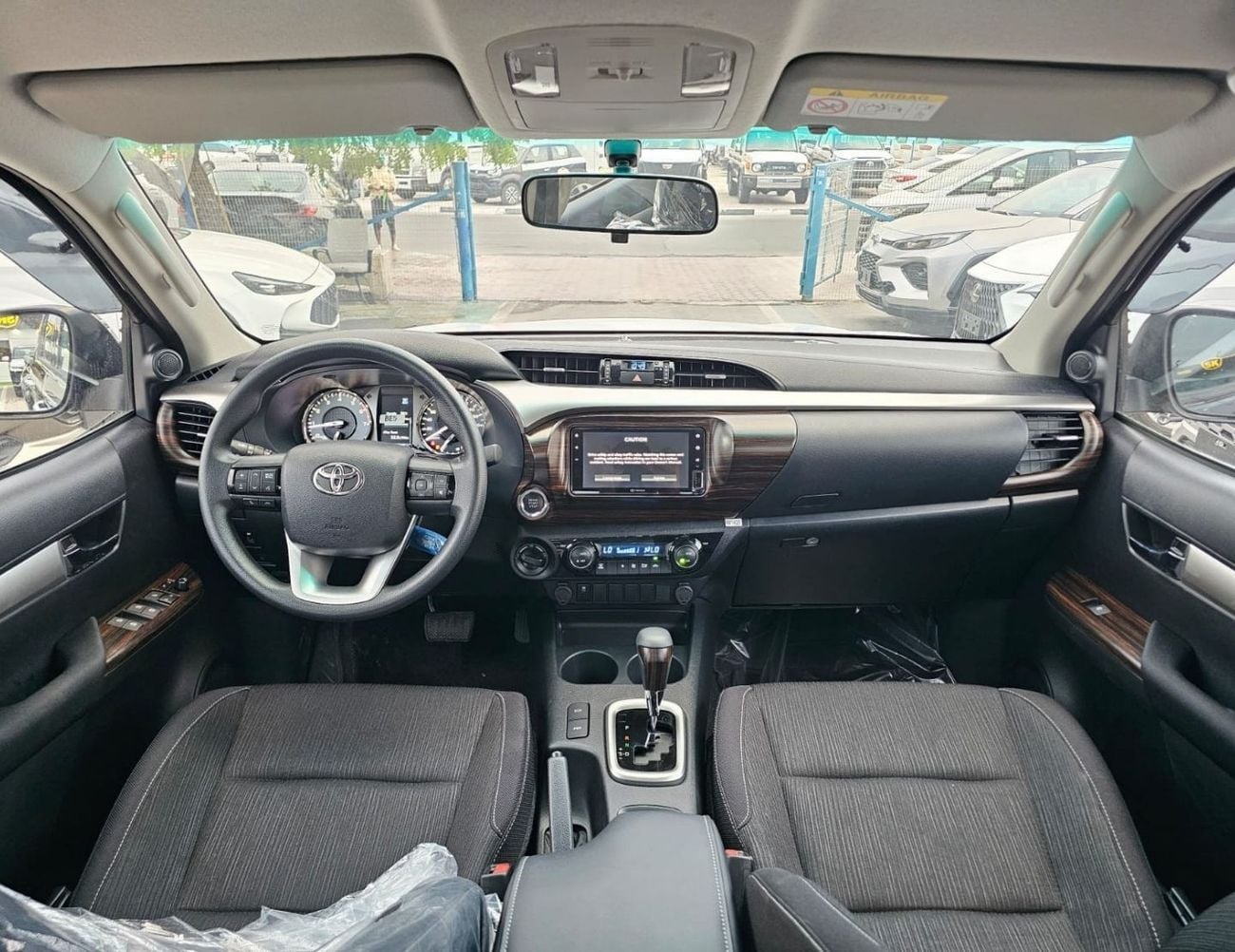 Toyota Hilux TOYOTA HILUX SR5 WIDE BODY DOUBLE CABIN || 2.7L PETROL A/T 4WD | BSM, WINOW VISOR, FOG LIGHTS, WOOD