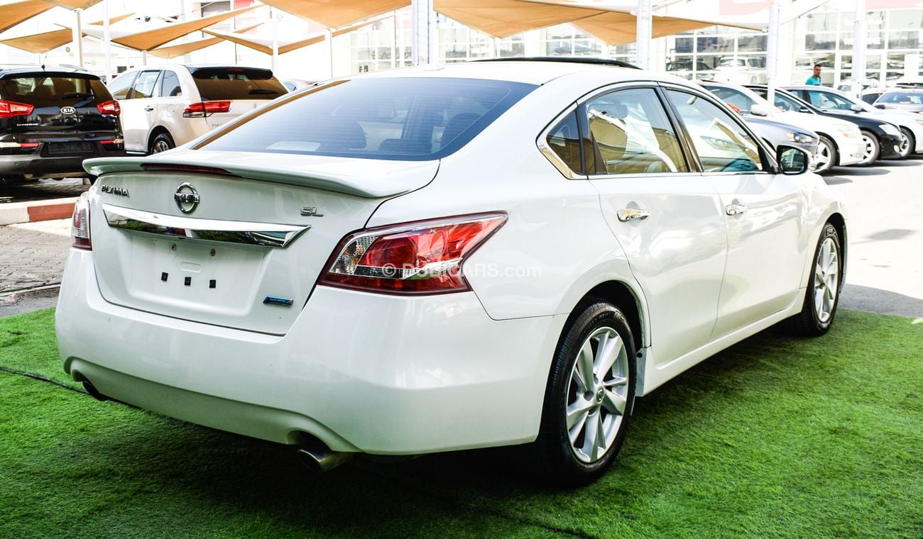 Nissan Altima White color inside Big Ward No.1 fingerprint slot, leather alloy wheels, camera screen control senso