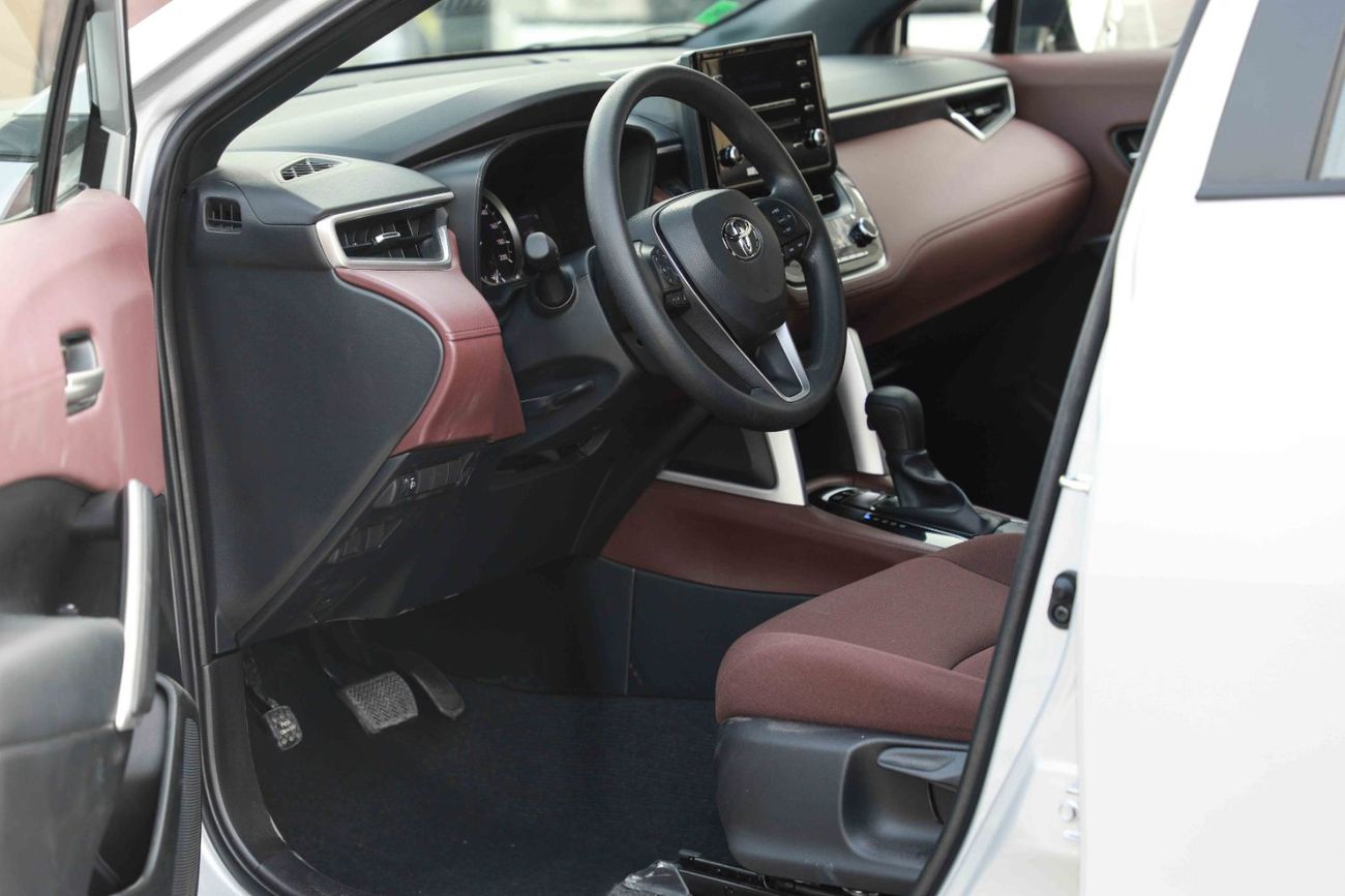 تويوتا كورولا كروس 1.8 Hybrid MID - Silver inside Red | Export Only