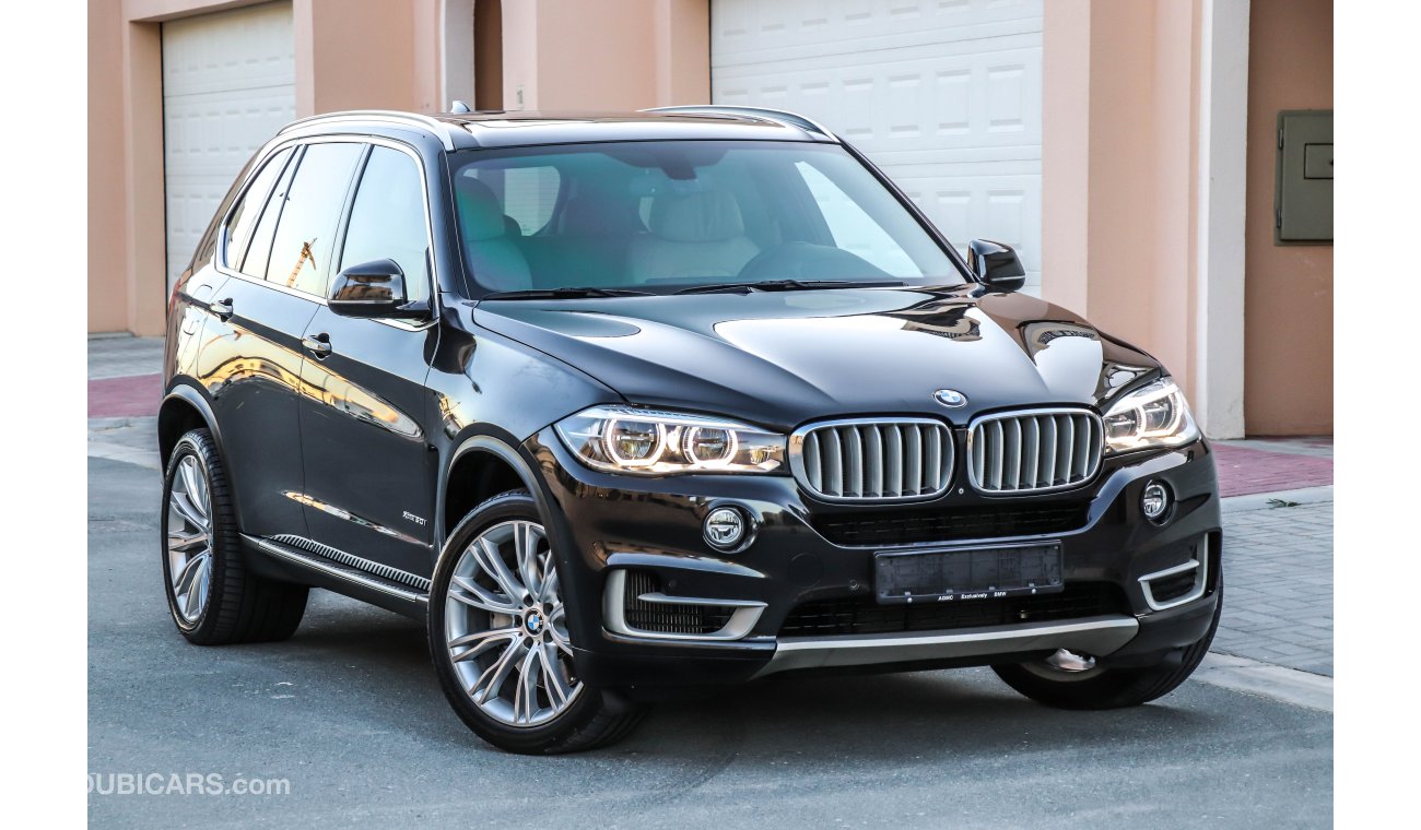 BMW X5 X-Drive 50i 2014 GCC under Agency Warranty & Service contract with Zero Down-Payment.