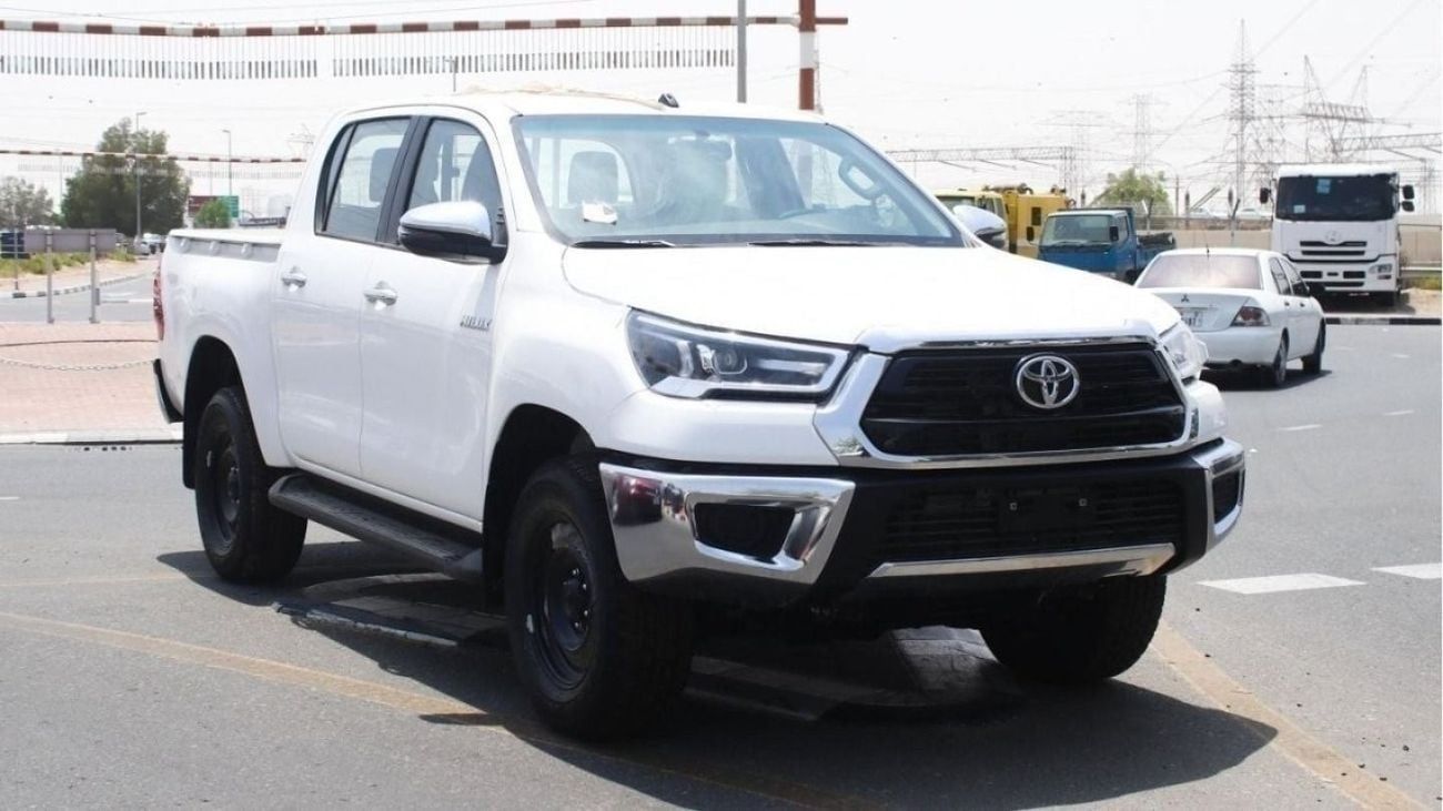 Toyota Hilux 2.4L diesel  . White 2025 model, M/T Wide body with Chrome bumper
