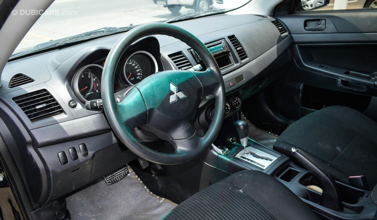 Mitsubishi Lancer ميتسوبيشي لانسر 2014حاله ممتازة بدون صبغ بدون حوادث حالة ممتازة داخل وخارج حالة الوكالة تحت الضمان