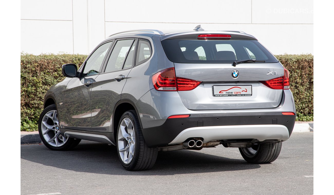 BMW X1 2012 - GCC - FULL OPTION - ASSIST AND FACILITY IN DOWN PAYMENT - 3235 AED/MONTHLY