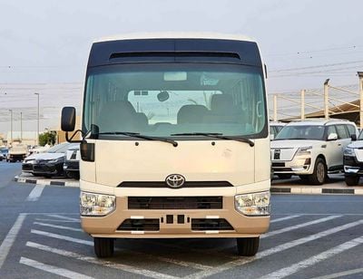 Toyota Coaster 2.7L PETROL M/T DUAL TONE / 23 SEATER / AUTO DOOR / HLF LUGGAGE RACK (CODE#COPB)