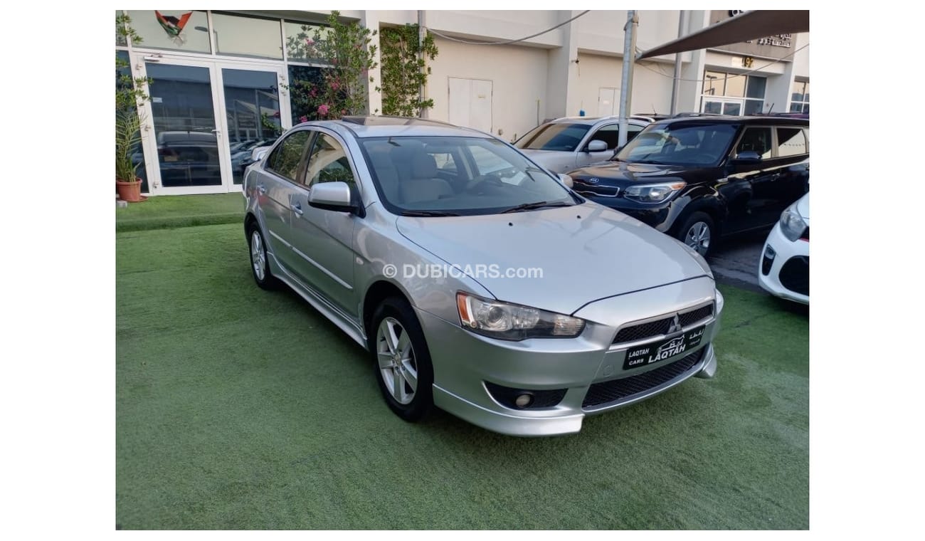 ميتسوبيشي لانسر 1600سى سى موديل 2009 خليجى فل أوبشن  خشب فتحة شاشة كاميرا خلفية بحالة ممتازة