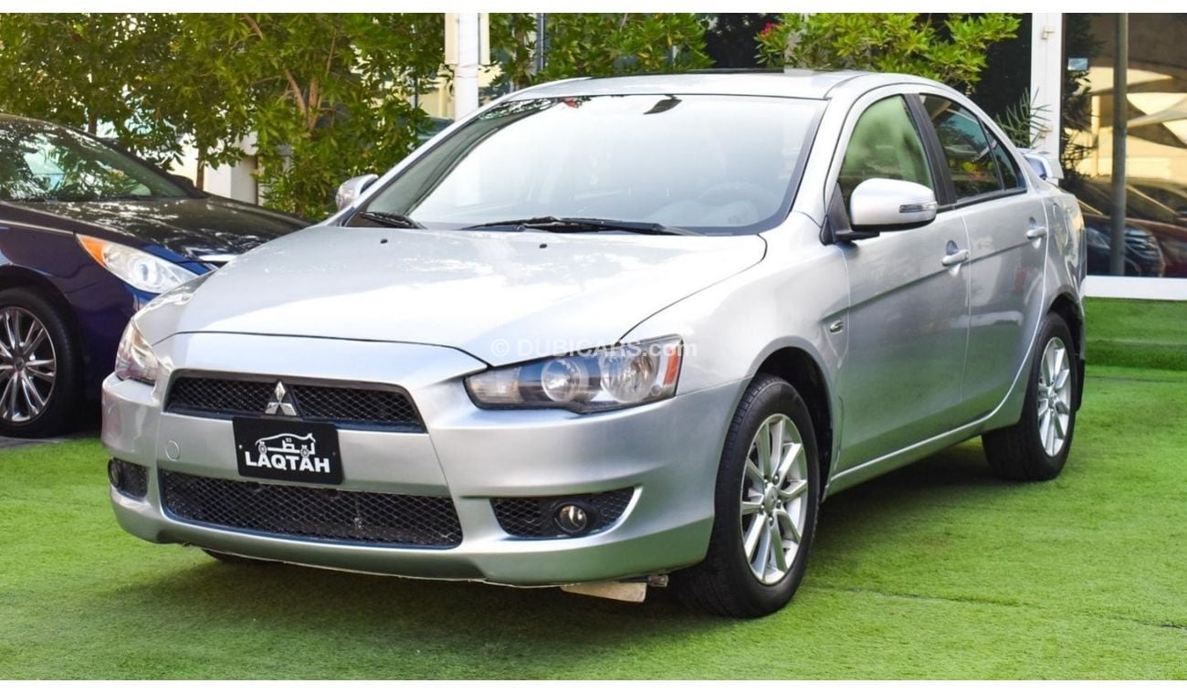 Mitsubishi Lancer 1600 CC, 2016 model, Gulf silver color, rear wing hatch, alloy wheels, FM radio, power conditioning,