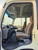 تويوتا كوستر 2.7L PETROL M/T DUAL TONE / 23 SEATER / AUTO DOOR / HLF LUGGAGE RACK (CODE#COPB)