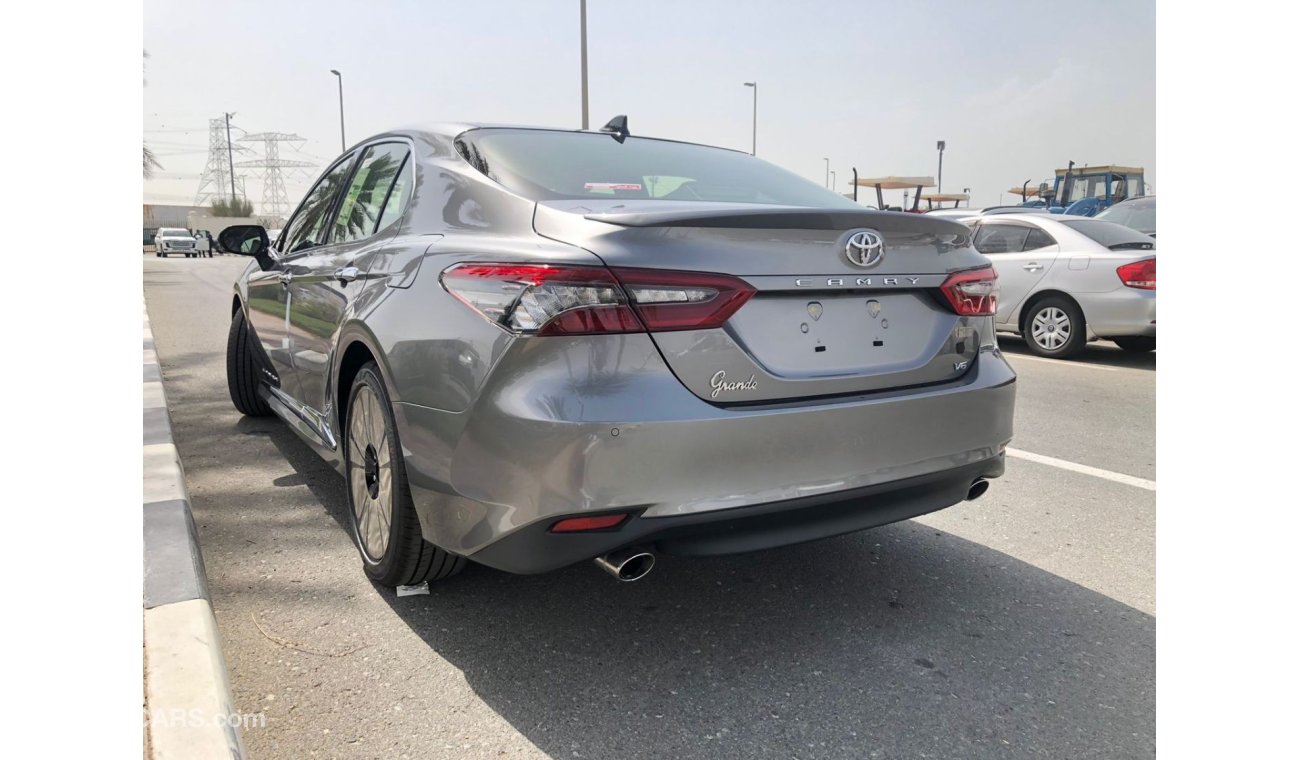 تويوتا كامري TOYOTA_CAMERY_GRANDE_2023_3.5L_avaialable_white_black_hybrid