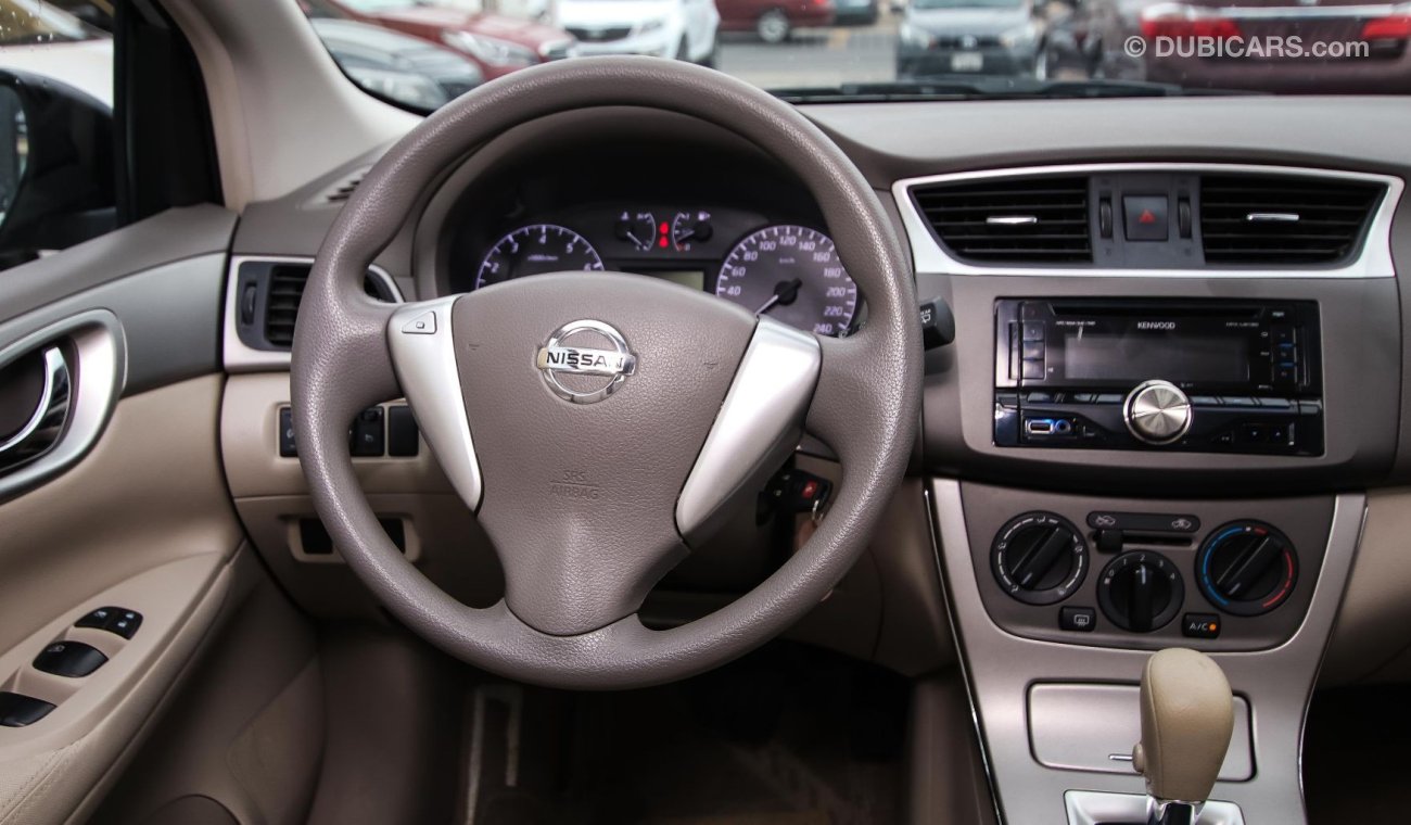 Nissan Tiida Pre-owned  for sale in Sharjah. Grey/Silver 2016 model, available at Wael Al Azzazi Shar