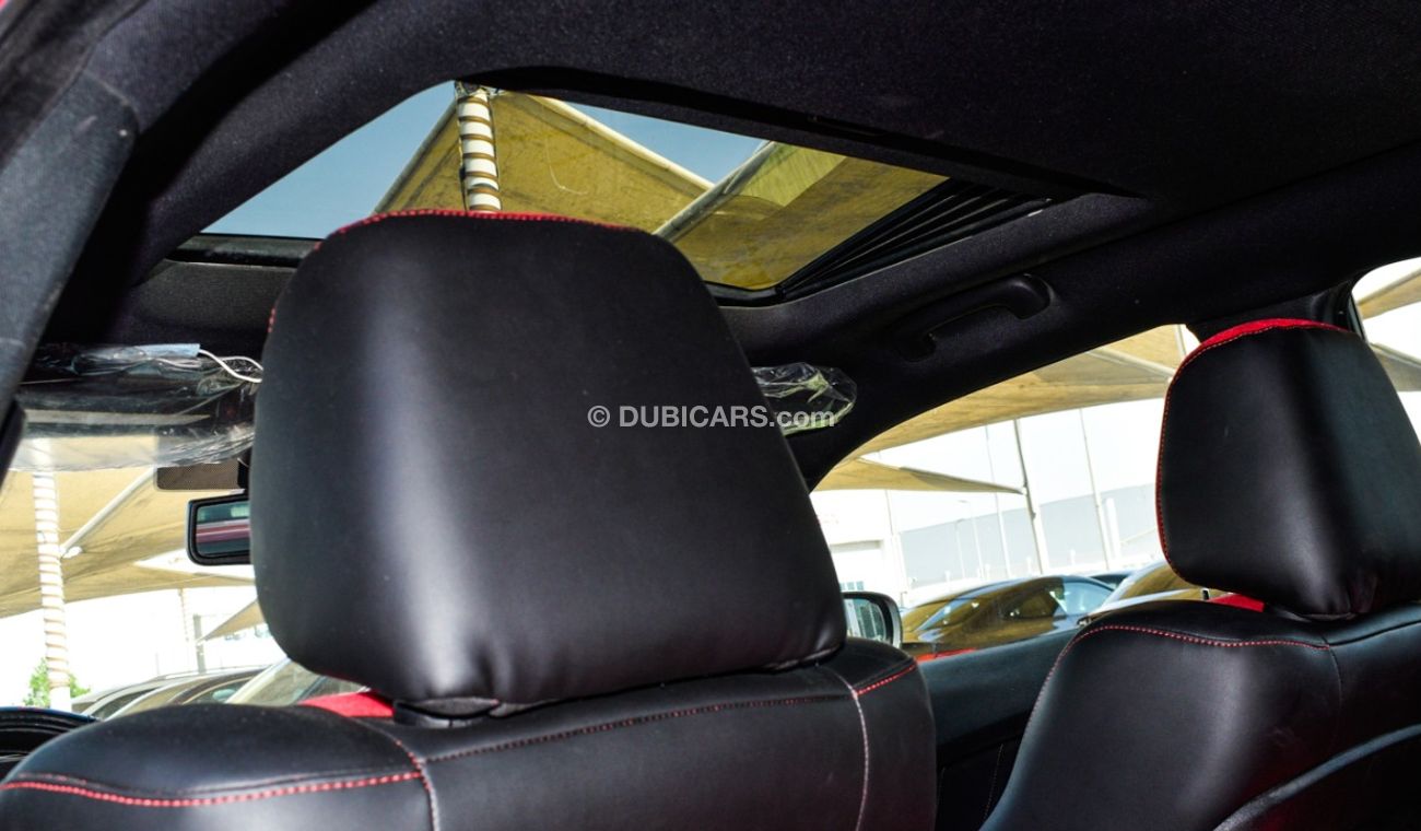 Dodge Charger Import - one number - manhole - leather - rear spoiler - cruise control - alloys - sensors in an abs