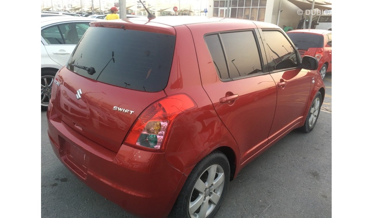 Suzuki Swift clean from the agency's first owner 2009 red color