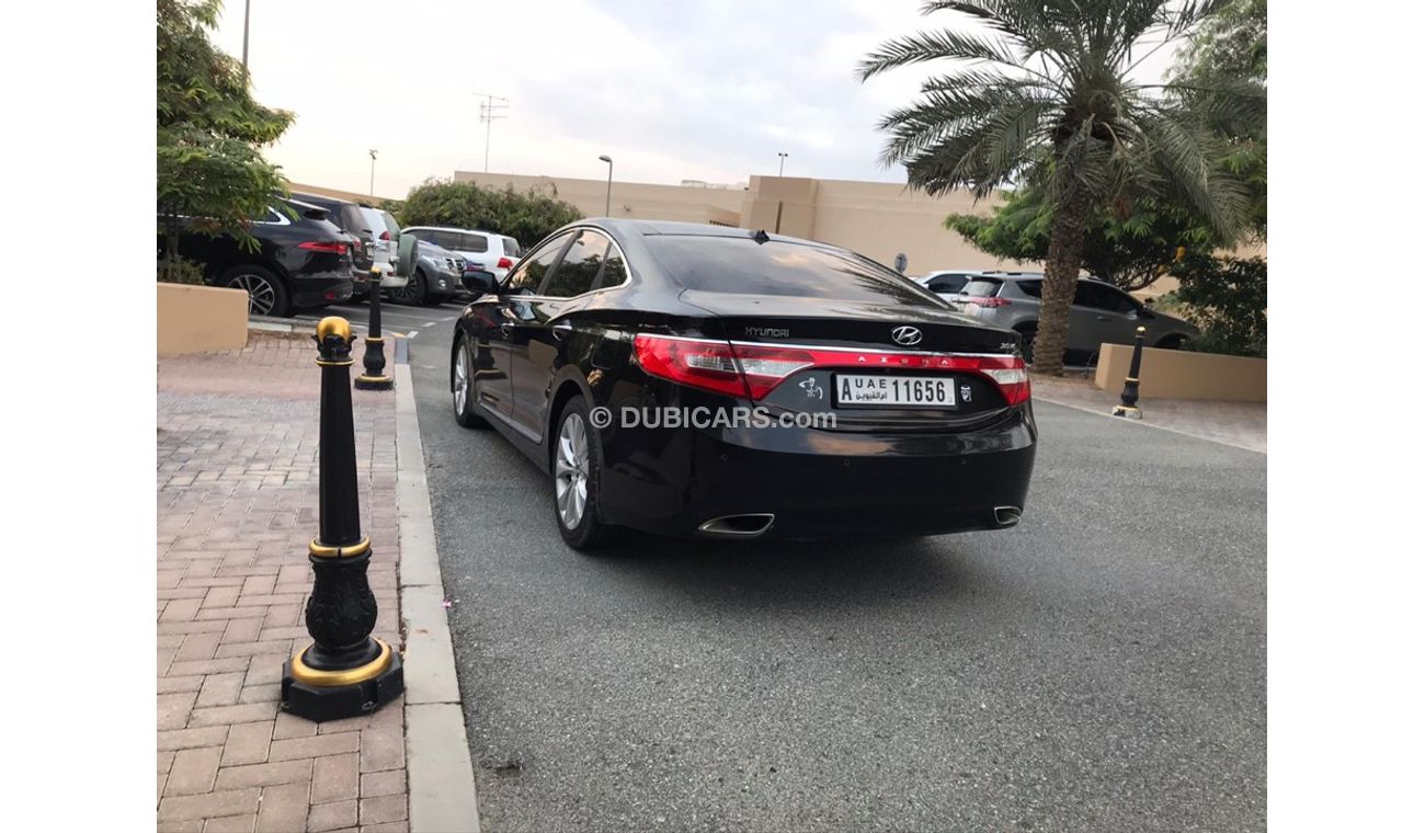 هيونداي أزيرا هيونداي ازيرا موديل 2013 خليجي صبغه وكاله فل اوبشن  بانوراما مثبت سرعه زكي كراسي جلد تبريد وتسخين