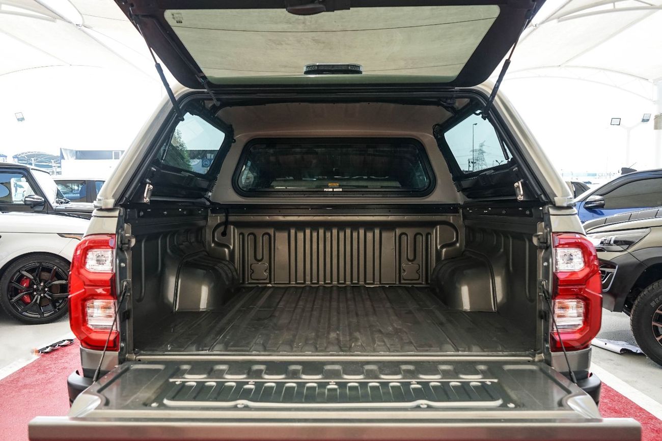 Toyota Hilux A Hilux canopy is a protective shell with a roof, walls, and windows that fits over the tray of a To