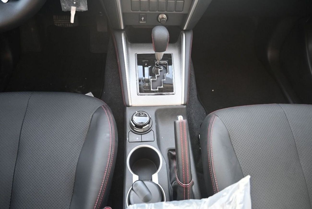 ميتسوبيشي L200 ميتسوبيشي L200 ديزل فل أوبتيون أوتوماتيك 2.4 لتر برتقالي من الخارج أسود من الداخل