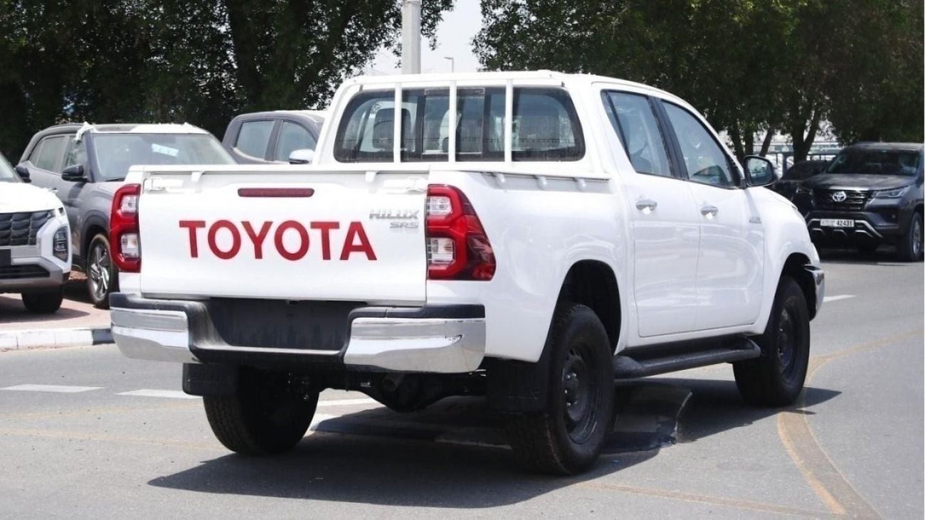 Toyota Hilux 2.4L diesel  . White 2025 model, M/T Wide body with Chrome bumper