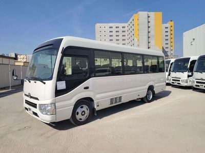 تويوتا كوستر 2025 Toyota Coaster High-Roof 23-Seater (2-Point Seatbelts) 4.0L 4-Cyl Turbo Diesel M/T RWD Export O
