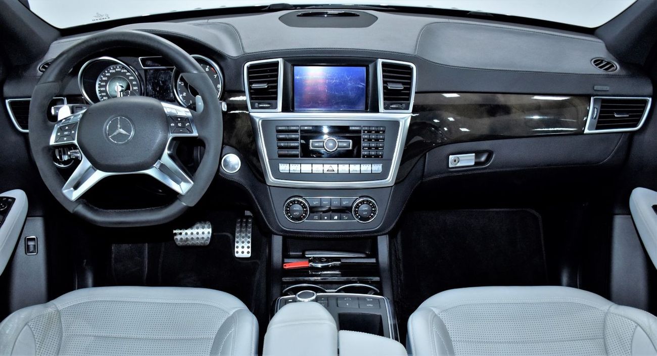 Mercedes-Benz ML 63 AMG EXCELLENT DEAL for our Mercedes Benz ML63 AMG ( 2013 Model ) in Dark Blue Color GCC Specs