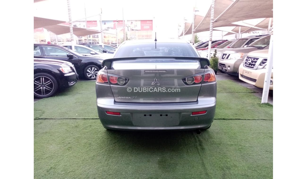 Mitsubishi Lancer Gulf gray color, inside beige without accidents, rear wing sensors, fog lights, in excellent conditi