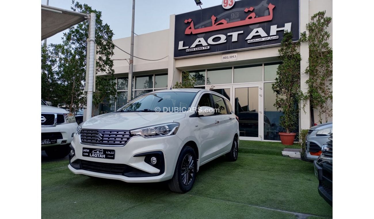 Suzuki Ertiga 2019 model, agency dye, 1600 cc, imprint, white color, rear wing, alloy wheels, air conditioning, wo