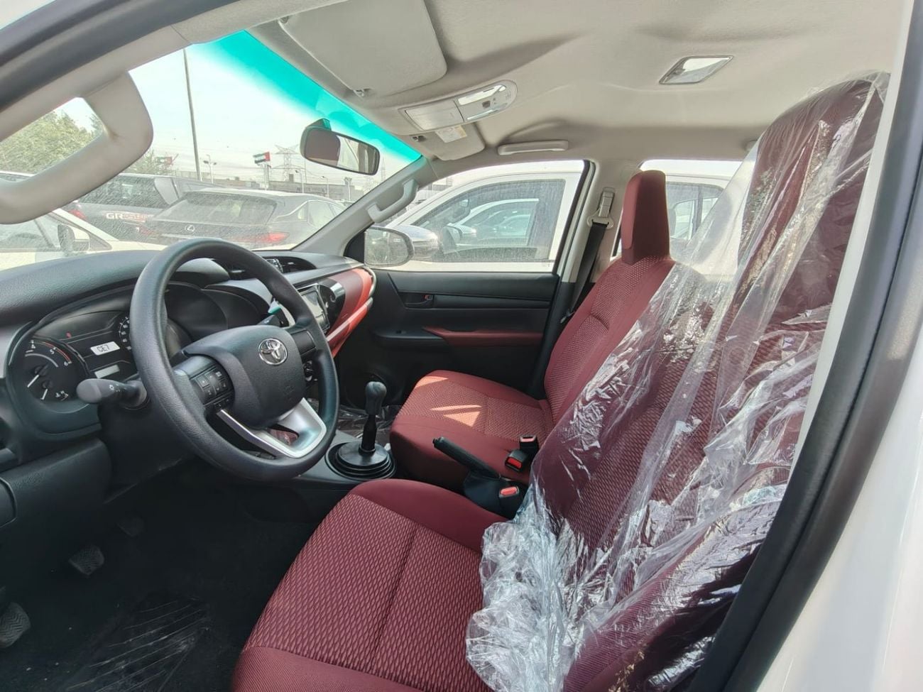 تويوتا هيلوكس 2026 Toyota Hilux white/red 2.4L diesel manual GCC spec mid option