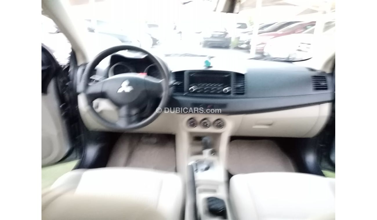 Mitsubishi Lancer Gulf gray color, inside beige without accidents, rear wing sensors, fog lights, in excellent conditi