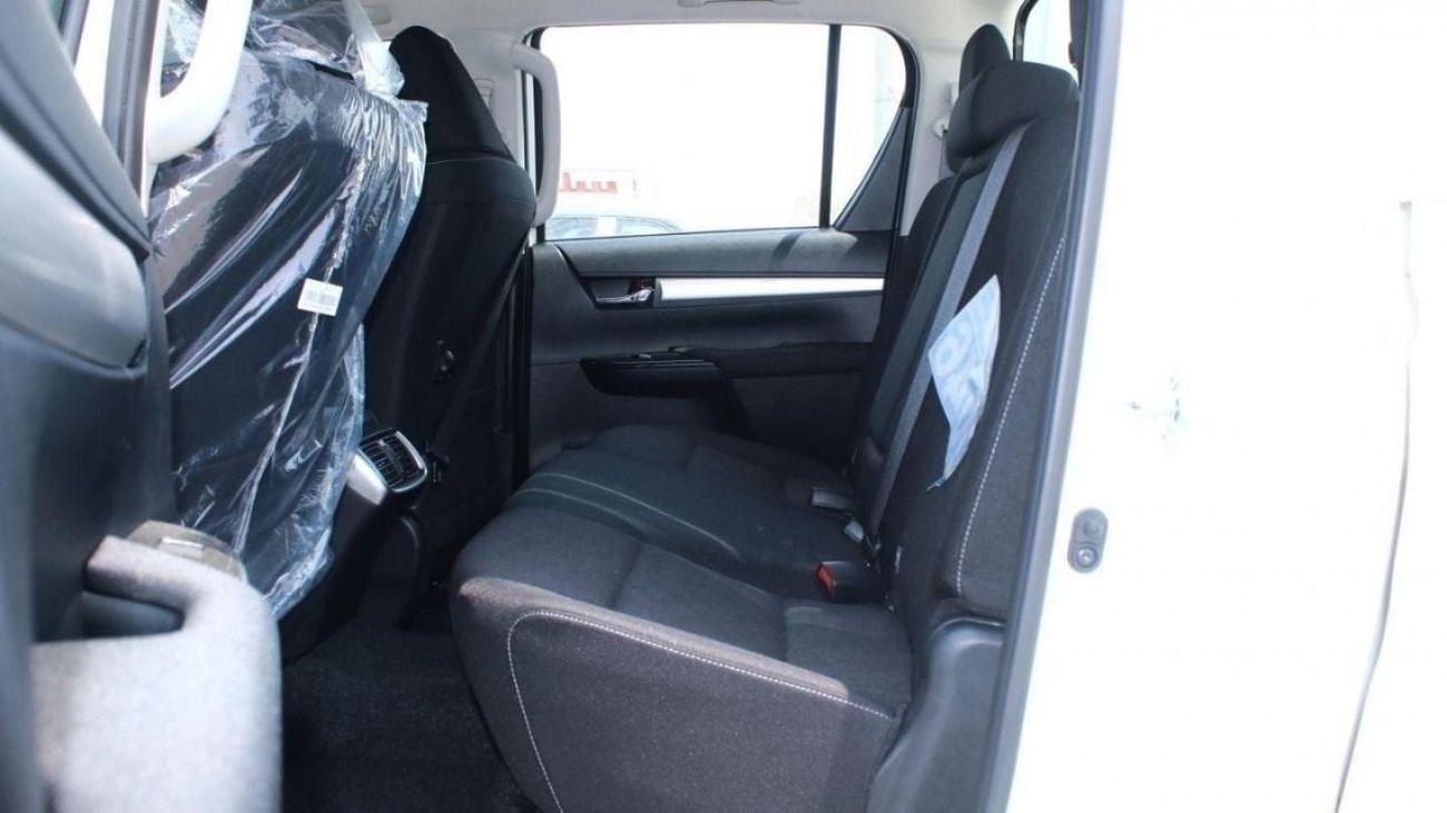 Toyota Hilux 2.4L diesel  . White 2025 model, M/T Wide body with Chrome bumper