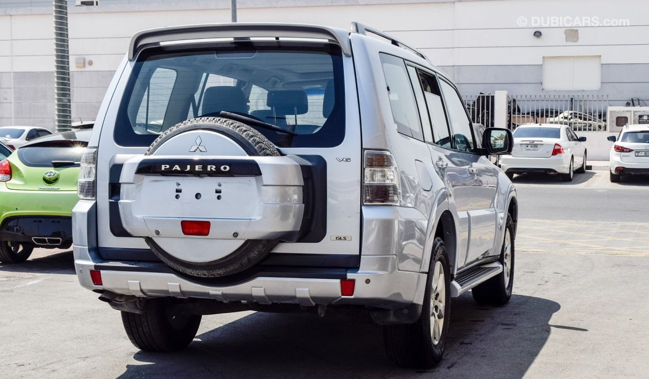 ميتسوبيشي باجيرو Pre-owned Mitsubishi Pajero GLS V6 for sale in Sharjah. Grey/Silver 2014 model, available at Wael Al