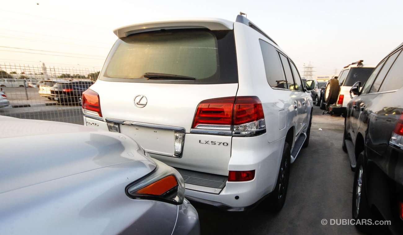 لكزس LX 570 FACELIFTED TO 2015 sports ( RIGHT HAND DRIVE ) ( EXPORT ONLY) pearl white with tan interior