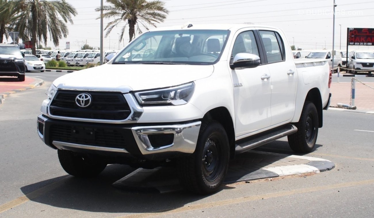 Toyota Hilux 2.4L diesel  . White 2023 model, M/T Wide body with Chrome bumper