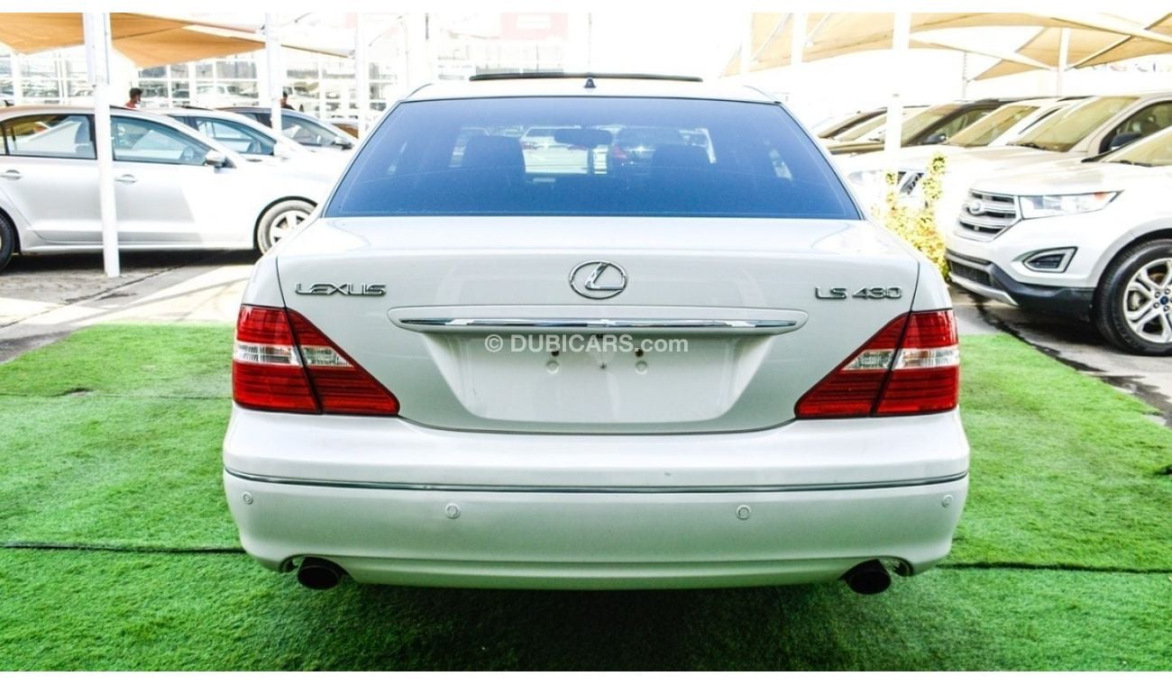 Lexus LS 430 Imported 1/2 Ultra, model 2006, white color, leather opening, wooden wheels, electric mirrors, excel
