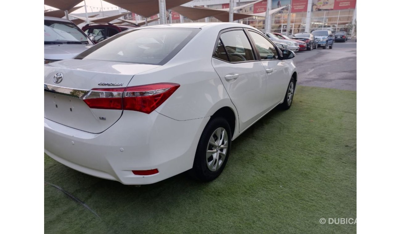 Toyota Corolla 1600 CC model 2016 GCC white color inside beige control unit in excellent condition