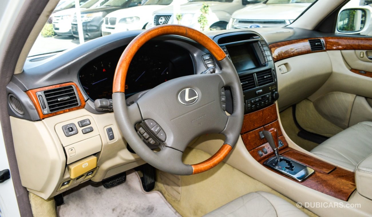 Lexus LS430 Imported 1/2 Ultra 2006 model, white color, leather opening, wooden wheels, electric mirrors, electr