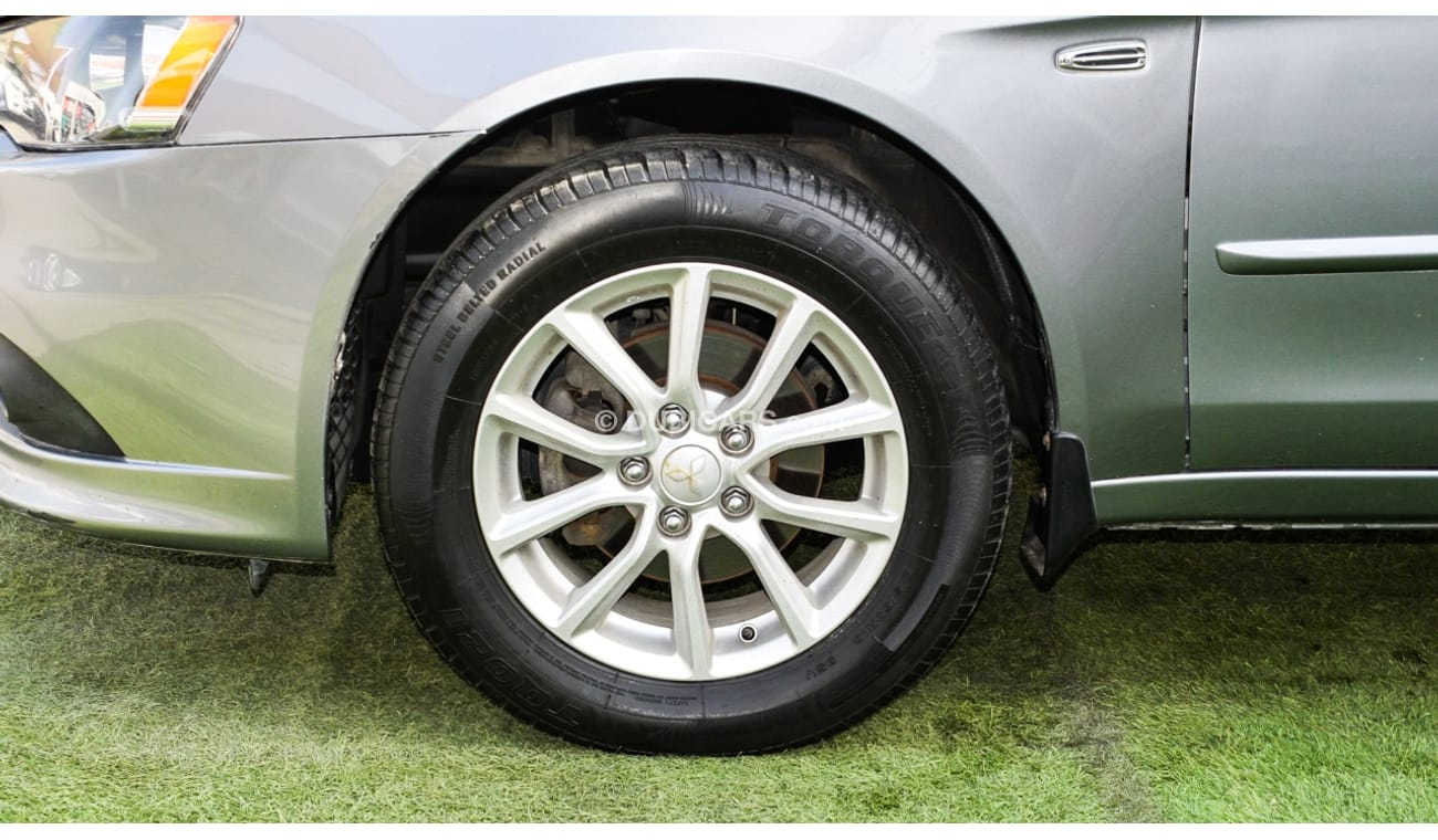 Mitsubishi Lancer Gulf gray color inside beige without accidents Rings rear wing sensors fog lights in excellent condi