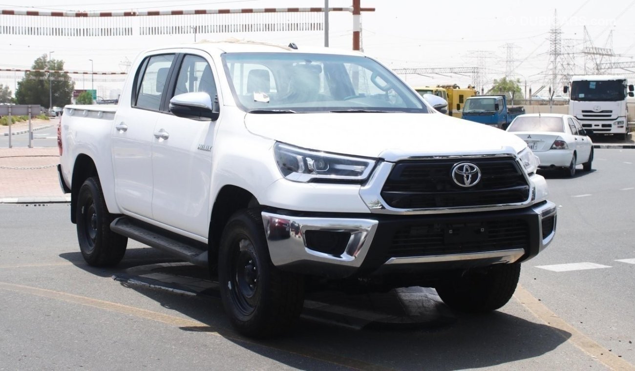 Toyota Hilux 2.4L diesel  . White 2023 model, M/T Wide body with Chrome bumper