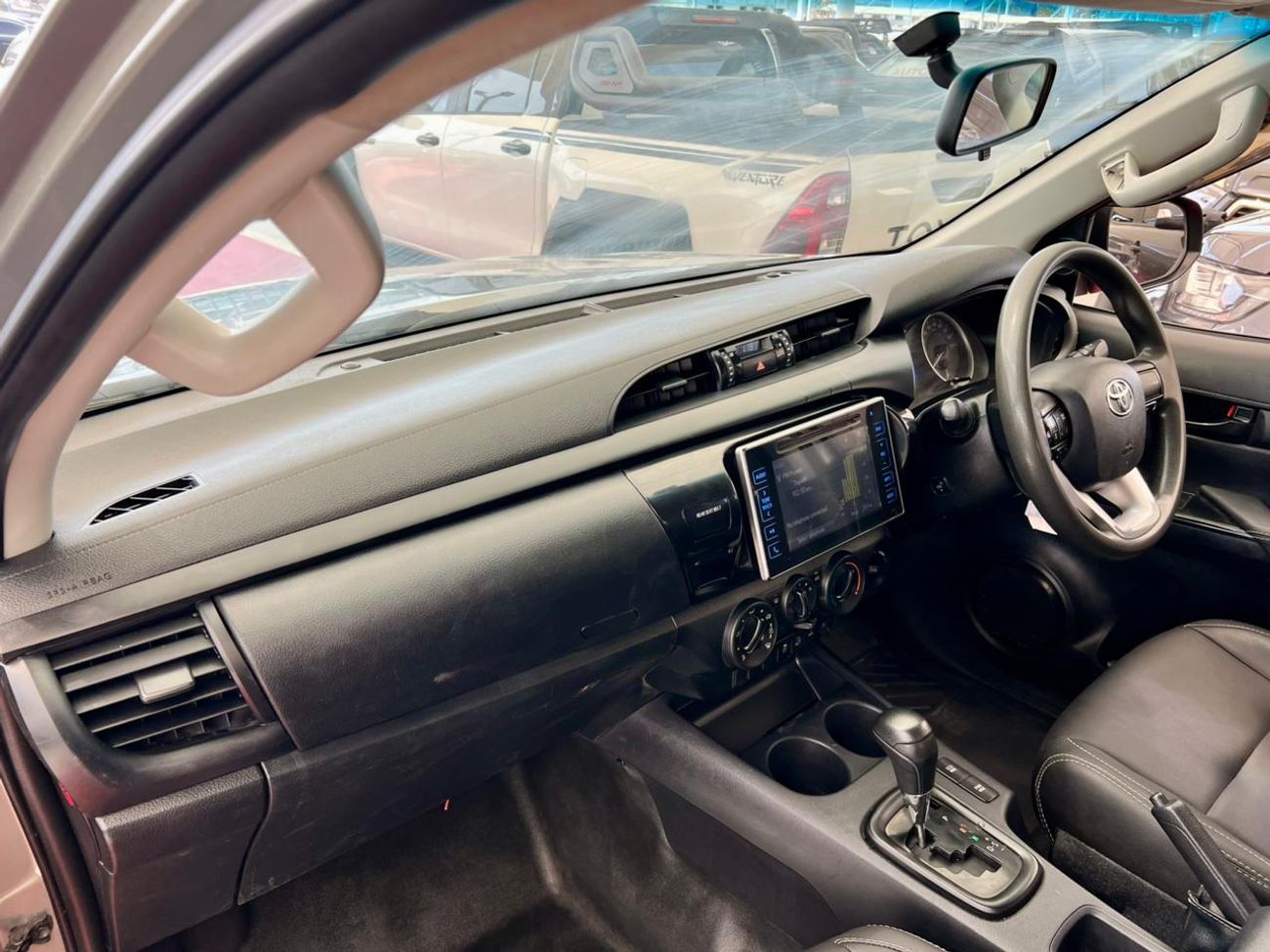 تويوتا هيلوكس The Toyota Hilux is a legendary, mid-size pickup truck known for its exceptional ruggedness, durabil