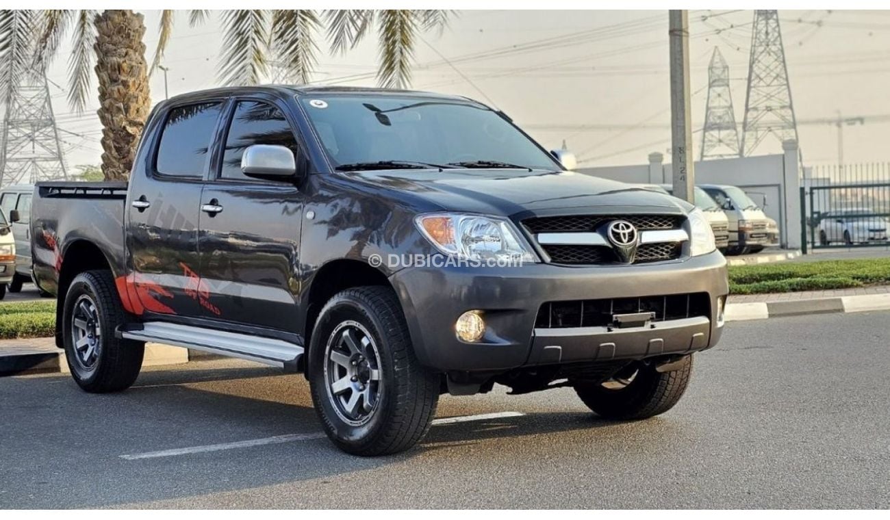 Toyota Hilux DIESEL 2KD | 2.5L ENGINE | LEFT-HAND-DRIVE | SIDE BODY STICKER | ALLOY RIMS | TINTED WINDOWS