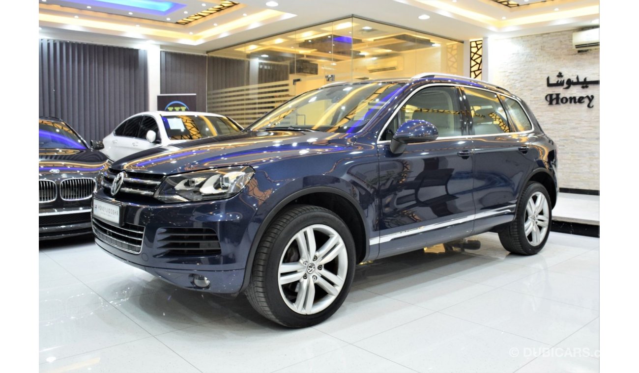 Volkswagen Touareg SEL EXCELLENT DEAL for our Volkswagen Touareg ( 2015 Model! ) in Blue Color! GCC Specs
