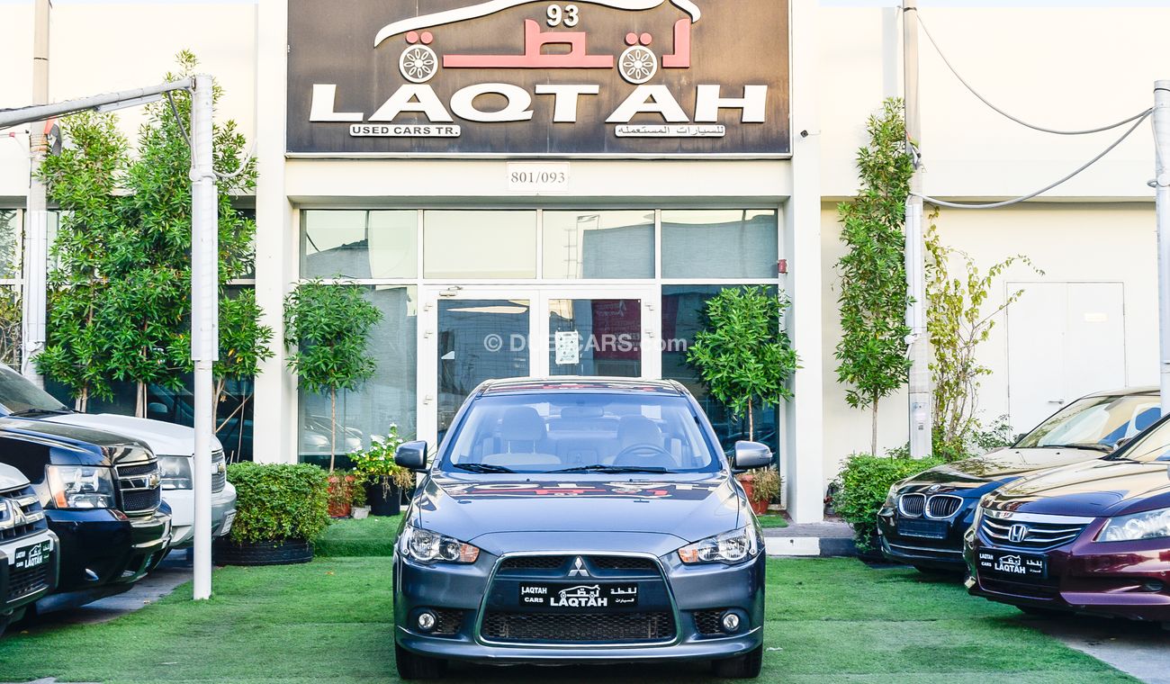 Mitsubishi Lancer Gulf gray color inside beige without accidents Rings rear wing sensors fog lights in excellent condi